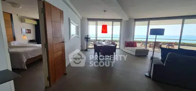Spacious open-plan living room with stunning ocean view and modern decor