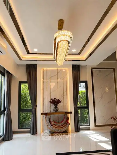 Luxurious living room with elegant chandelier and modern decor