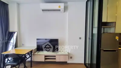 Modern living room with air conditioning and sleek furniture design.