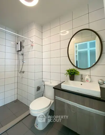 Modern bathroom with sleek tiles and stylish fixtures