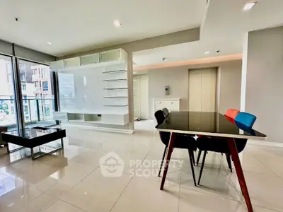 Spacious modern living room with sleek dining area and large windows