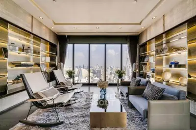 Luxurious modern living room with panoramic city view and elegant decor.