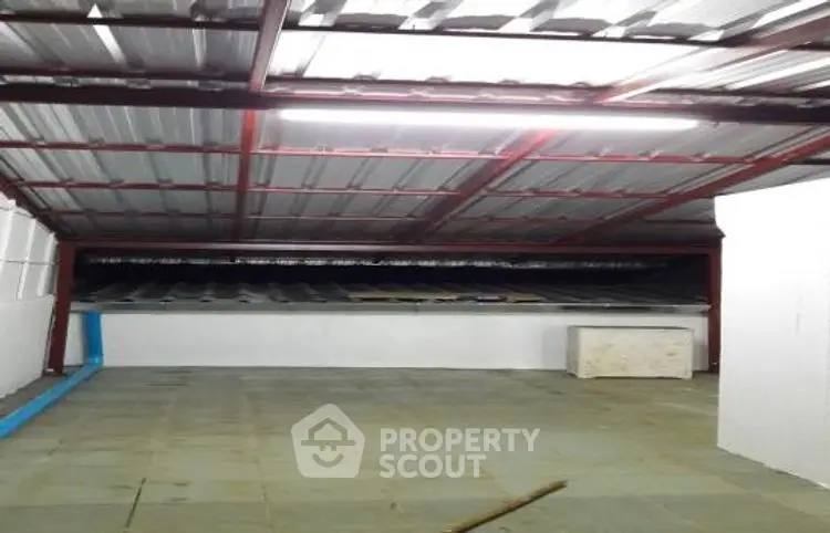 Spacious attic storage area with metal roofing and ample floor space.