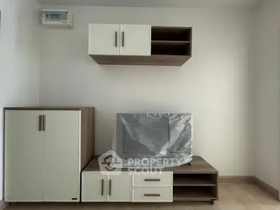 Modern living room with stylish storage cabinets and sleek TV stand, perfect for contemporary homes.