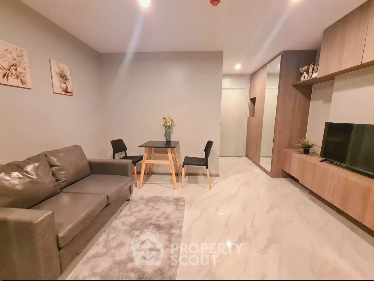 Modern living room with sleek furniture and elegant decor in a stylish apartment.