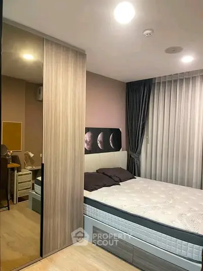 Modern bedroom with stylish decor and cozy ambiance, featuring a comfortable bed and elegant lighting.