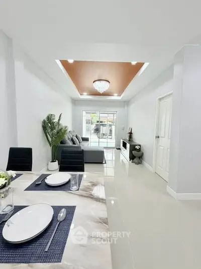 Elegant modern living room with dining area and stylish decor