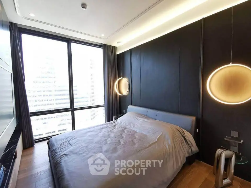 Luxurious modern bedroom with floor-to-ceiling windows and stylish lighting in urban apartment.