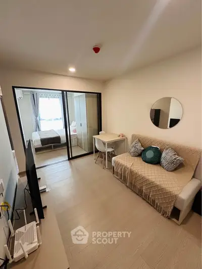 Modern living room with cozy sofa and stylish decor in a compact apartment
