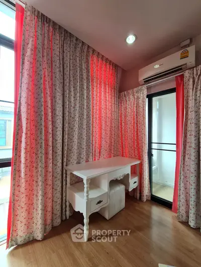 Charming study room with floral curtains and elegant white desk