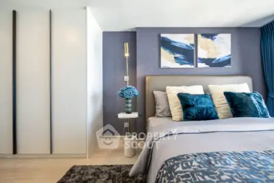 Luxurious modern bedroom with stylish decor and plush bedding in a serene setting.