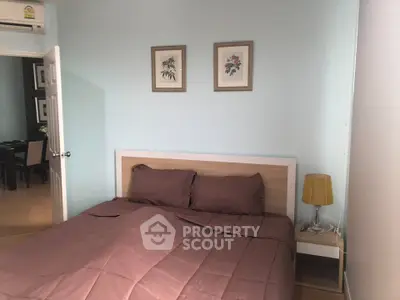 Cozy bedroom with modern decor and soft lighting, perfect for relaxation and comfort.