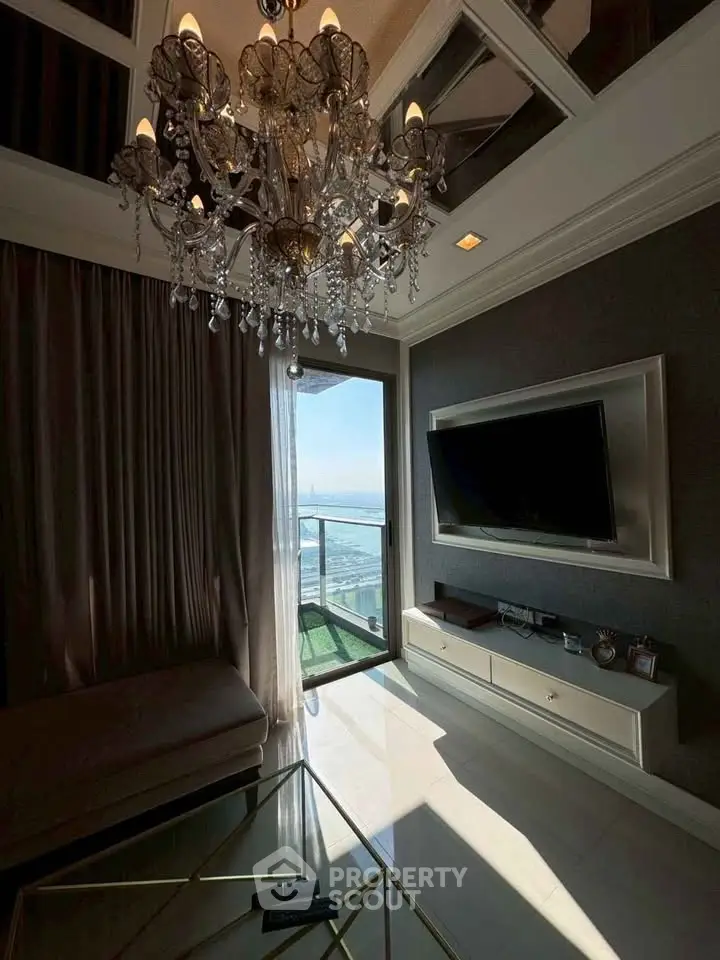 Luxurious living room with chandelier and stunning city view