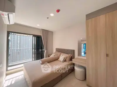 Modern bedroom with balcony access in a stylish apartment