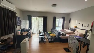 Spacious living room with modern decor and ample natural light