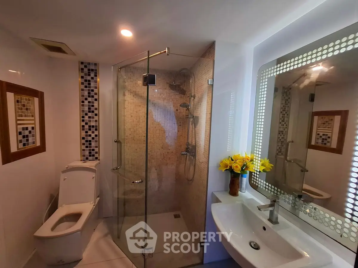 Modern bathroom with glass shower and stylish decor