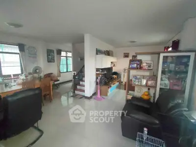 Spacious living room with modern furniture and open layout, perfect for family gatherings.