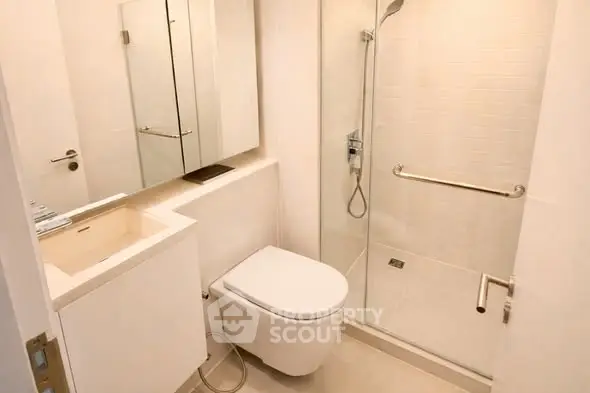 Modern bathroom with glass shower and sleek fixtures