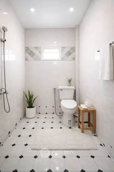 Modern bathroom with elegant tile design and sleek fixtures