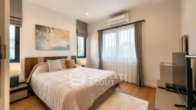 Cozy bedroom with modern decor and natural light, featuring a comfortable bed and stylish furnishings.