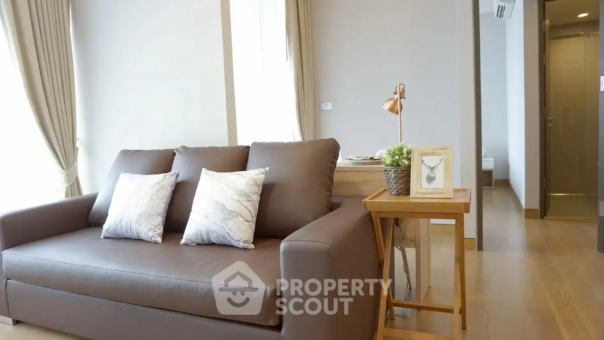 Modern living room with stylish sofa and elegant decor in a bright apartment.