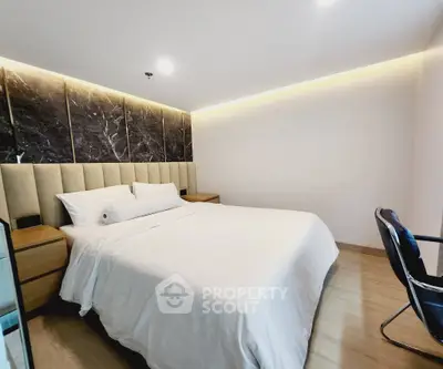 Luxurious modern bedroom with elegant lighting and stylish decor