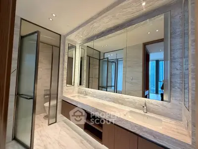 Luxurious modern bathroom with dual sinks and elegant marble finishes