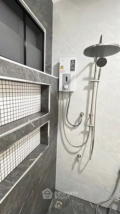 Modern bathroom with sleek shower and built-in shelving