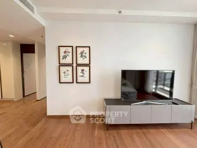 Modern living room with sleek TV stand and wooden flooring