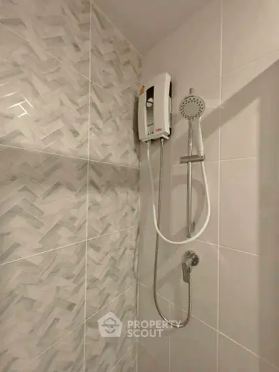 Modern bathroom shower with stylish tile design and water heater