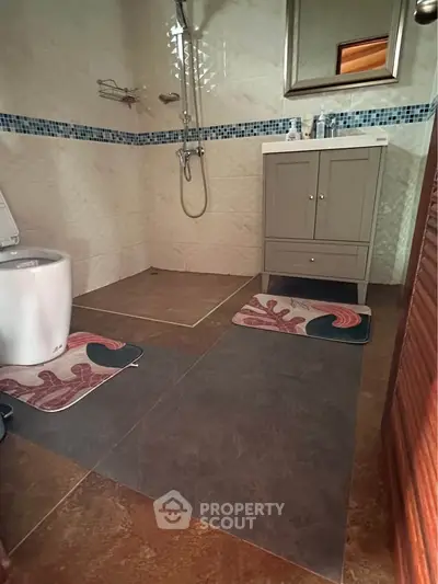 Modern bathroom with elegant tiles and stylish vanity unit