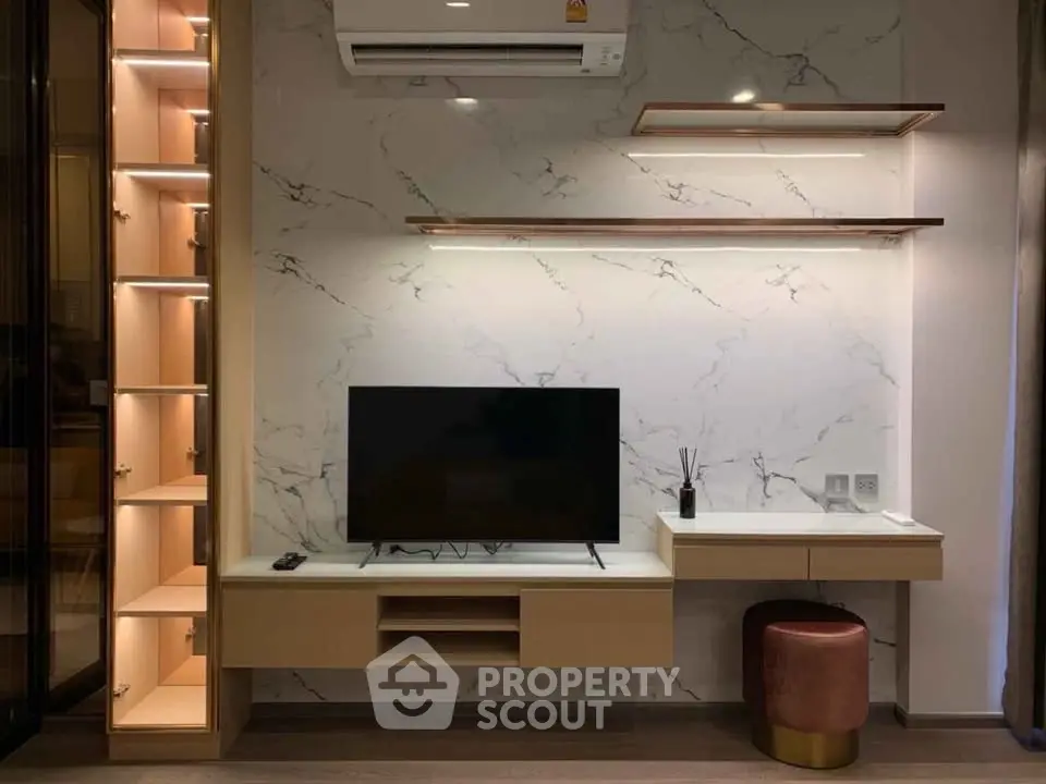 Modern living room with sleek TV unit and marble accent wall