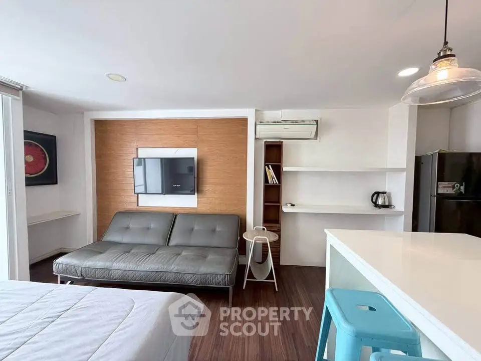 Modern studio apartment with sleek furnishings and open layout