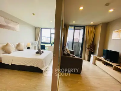 Spacious modern bedroom and living room with large windows and stylish decor