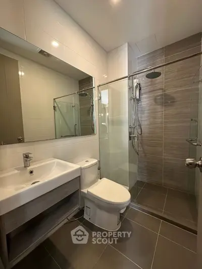 Modern bathroom with glass shower and sleek fixtures