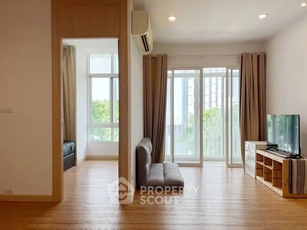 Modern living room with natural light and balcony view