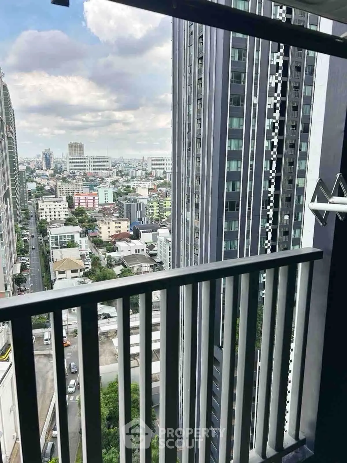 Stunning cityscape view from a modern high-rise balcony, perfect for urban living enthusiasts.