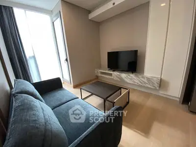 Modern living room with sleek furniture and natural light