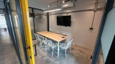 Modern office meeting room with sleek design and ample seating