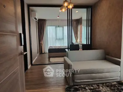 Modern apartment interior with cozy living area and stylish bedroom view.