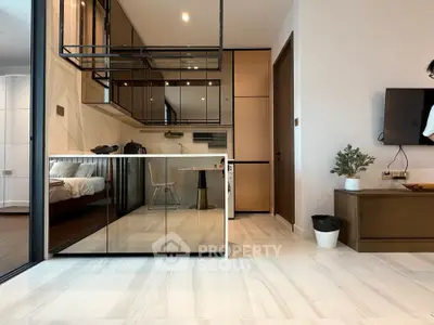 Modern open-plan living area with sleek kitchen and stylish decor