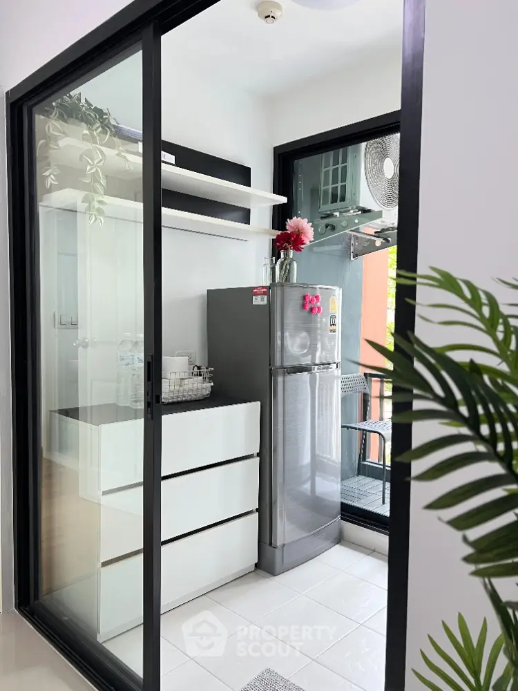 Modern kitchen with sleek design and stainless steel fridge in stylish apartment