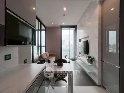 Modern open-plan kitchen and living room with city view, sleek marble finishes, and stylish decor.