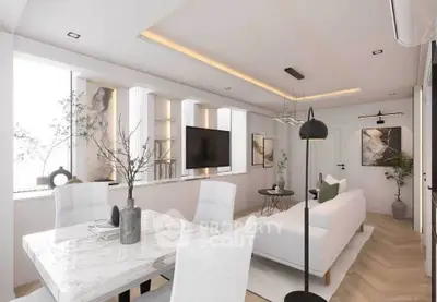 Modern open-plan living and dining area with elegant decor and natural light.