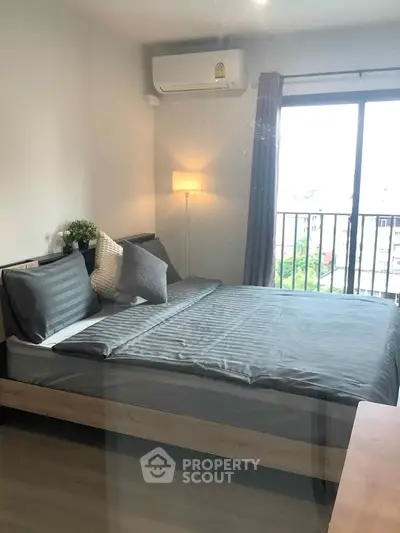 Modern bedroom with balcony view and stylish decor