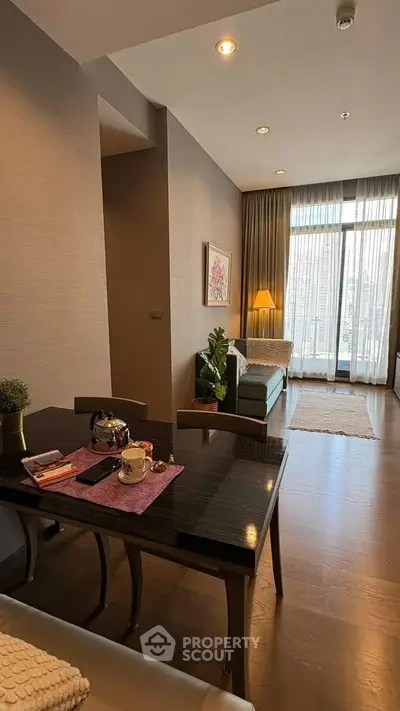 Stylish living room with modern decor and city view balcony in luxury apartment.