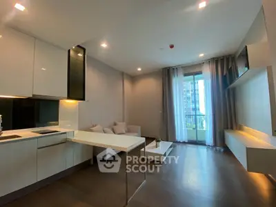 Modern living room with open kitchen and balcony view in luxury apartment