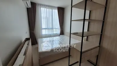 Modern bedroom with natural light and stylish wooden furniture