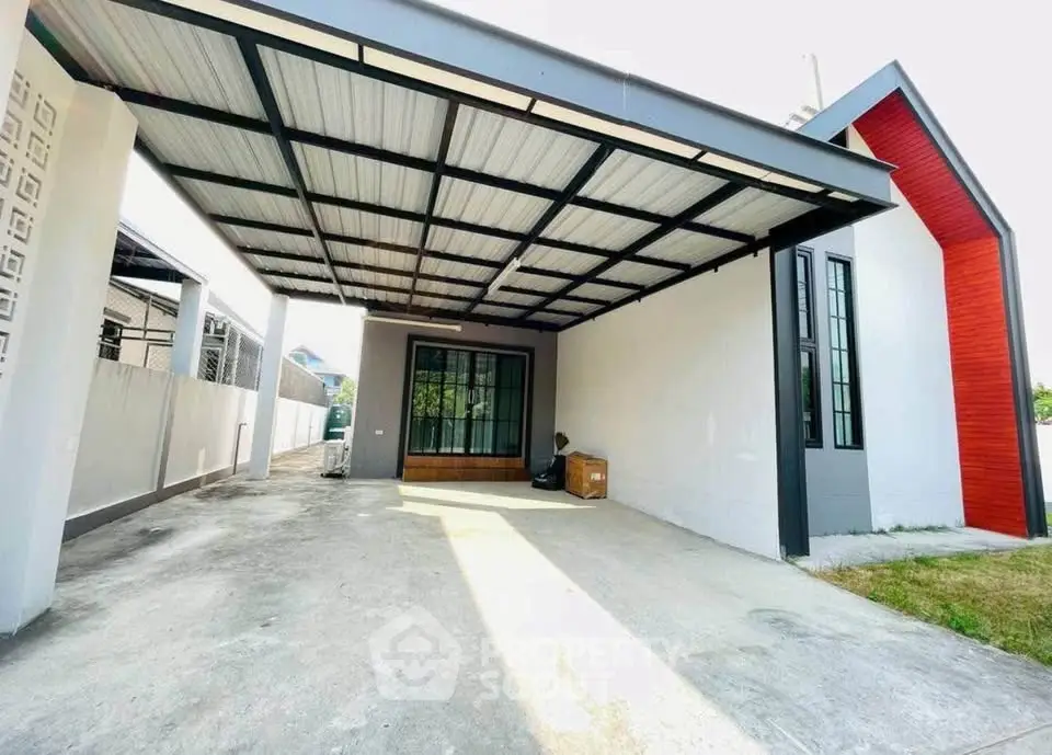 Modern house with spacious carport and sleek architectural design