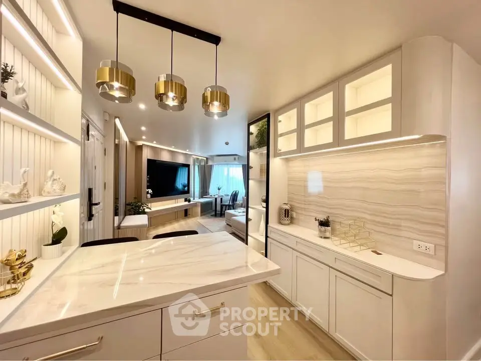 Luxurious modern kitchen with marble countertops and elegant lighting